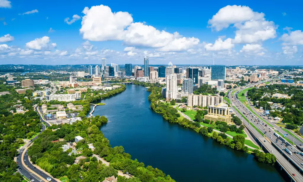 Austin Texas sunny day with blue sky and gorgeous water over town lake skyline is a great place to go after you get your medical marijuana card