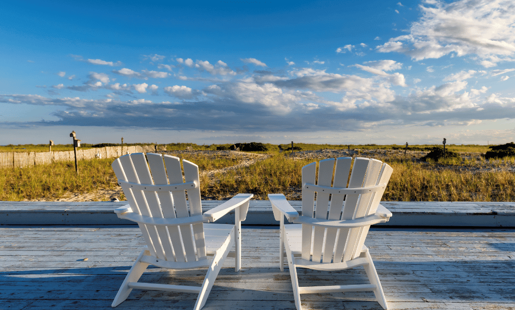beach chairs on Cape Cod beach at sunset is a great place to visit after getting your medical card