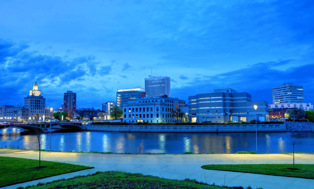 downtown cedar rapids buildings along the river in the evening is a great place to visit after getting your medical card