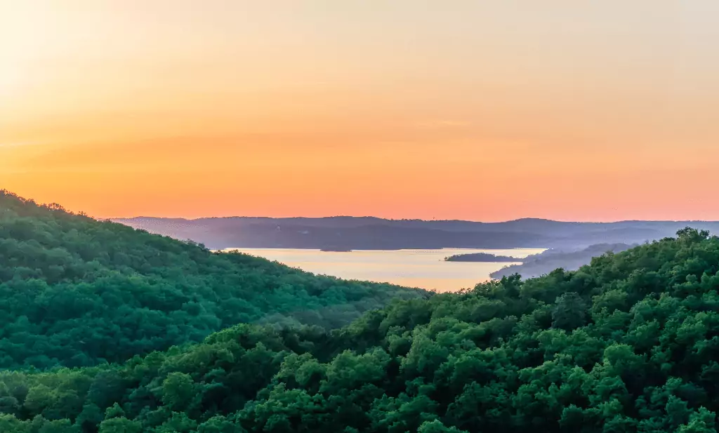 Colorful  horizon overlooking lake of the ozarks at sunset is a great place to visit after getting your medical card