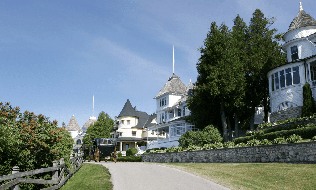 row of historic victorian era homes on the bluffs on mackinac island is a great place to visit after getting your medical card