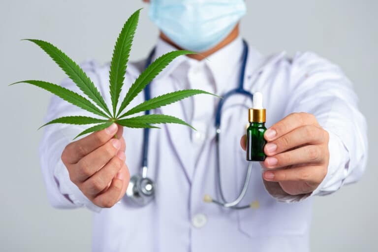 medical marijuanas statistics with a physician holding a cannabis leaf and tincture bottle