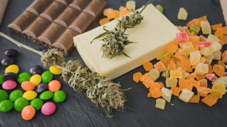 an assortment of cannabis, butter, chocolate, and edible gummies